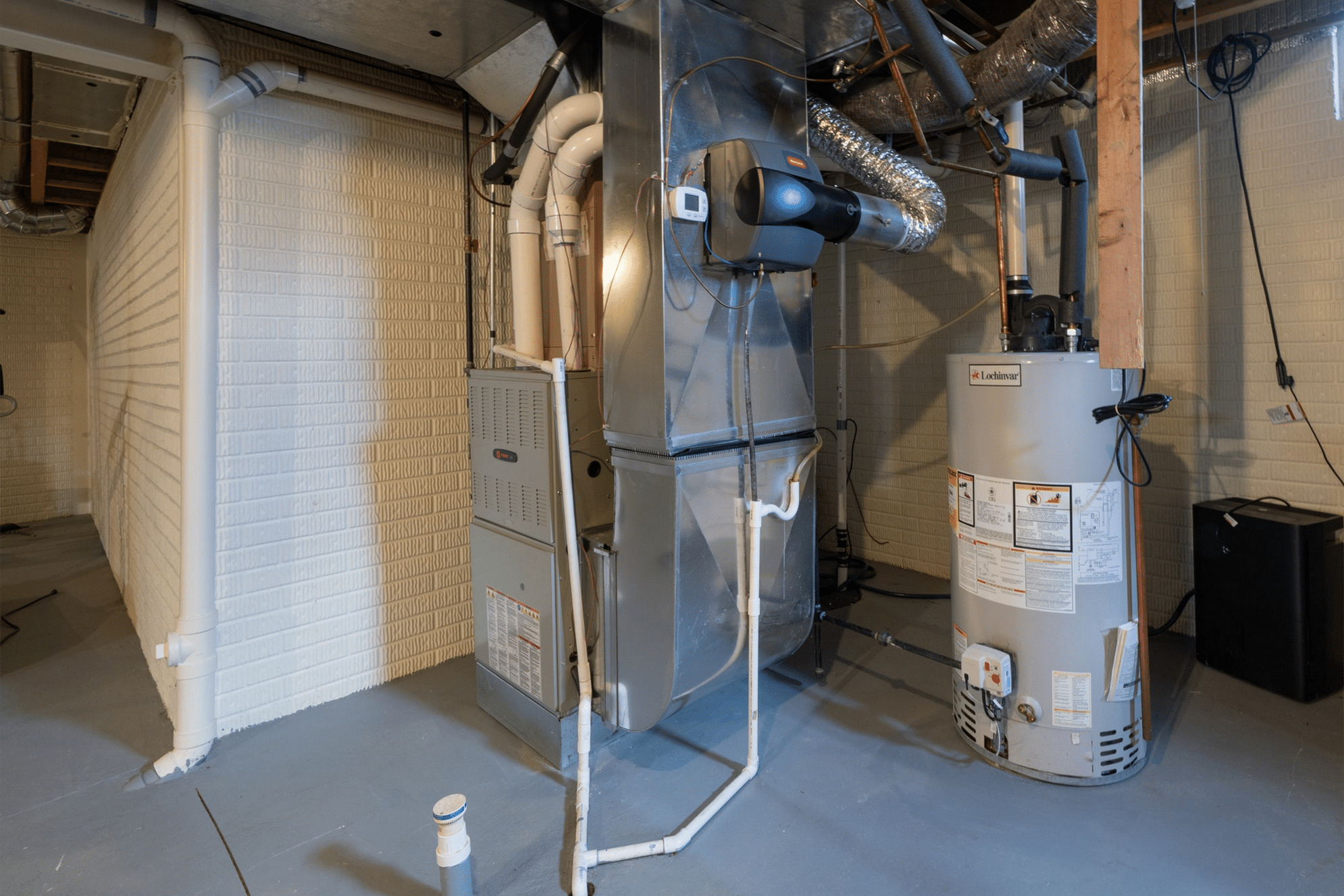 Basement HVAC system and water heater installation.