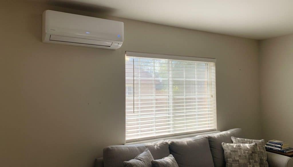 Ductless mini-split indoor air handler mounted on a living room wall in a Southern California home