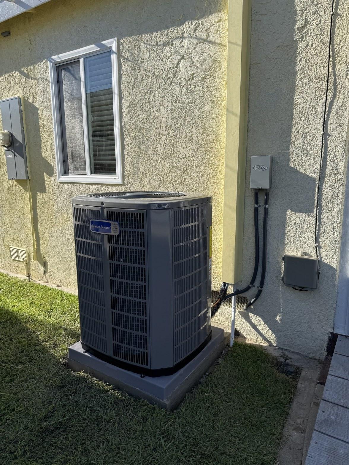 American Standard AC Installation outdoor condenser unit on concrete pad